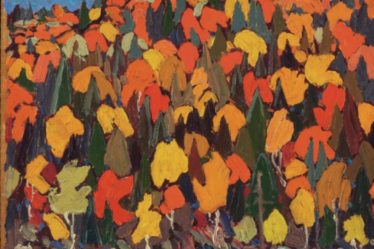 Impressionistic oil painting of a dense autumn forest in vivid orange, red, and yellow foliage among dark green evergreens above a rocky shoreline and blue water.